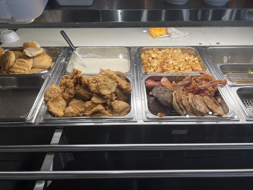 Buffet-style serving area with Southern breakfast favorites.